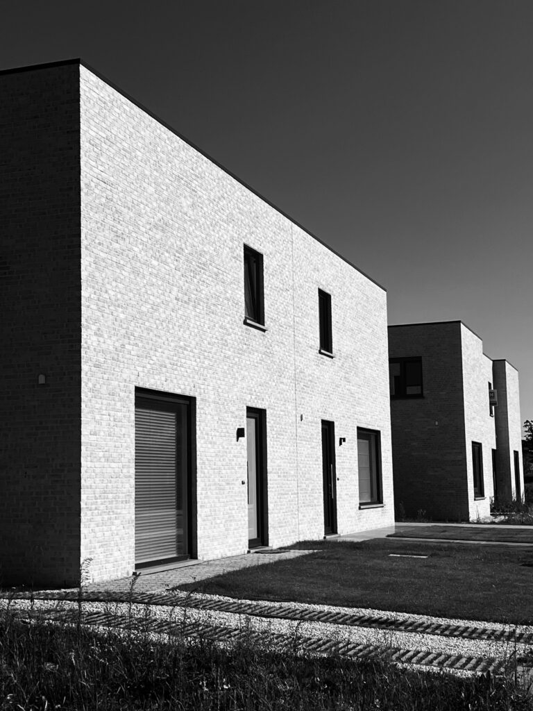 Stylish modern Belgian residential buildings showcased in black and white photography.
